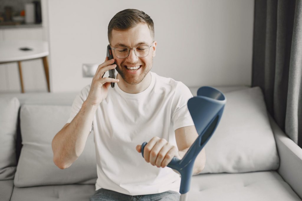 A Man Smiling While on a Call